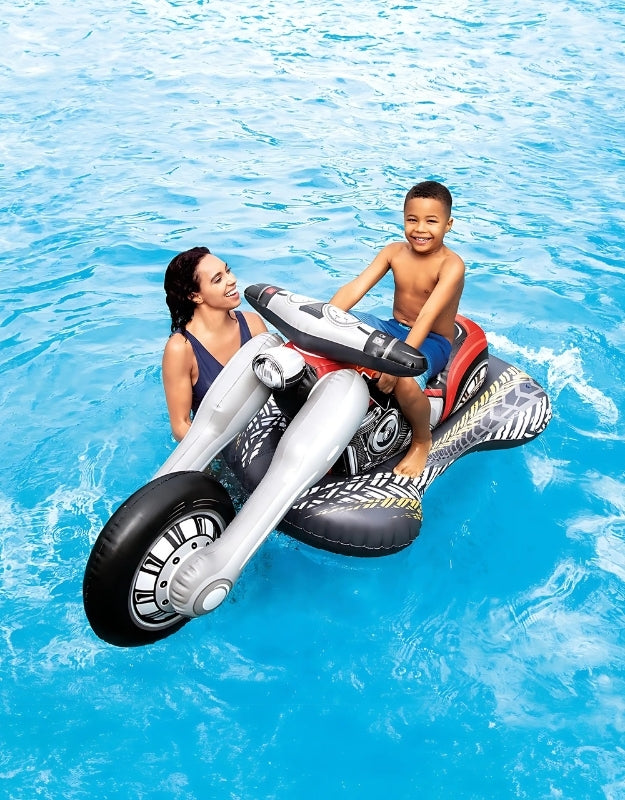 A child riding the inflatable Intex Cruiser Motorcycle pool float in a swimming pool