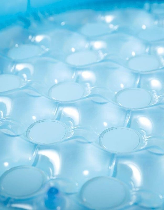 Close-up of the bubbly floor inside the Intex mushroom baby pool