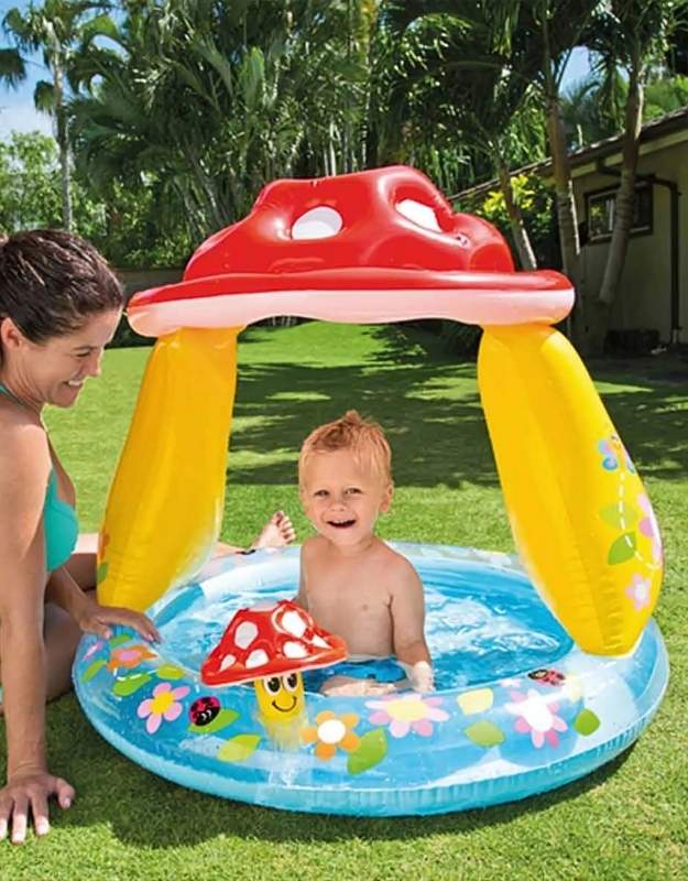  A mother and baby playing in the Intex mushroom baby pool.
