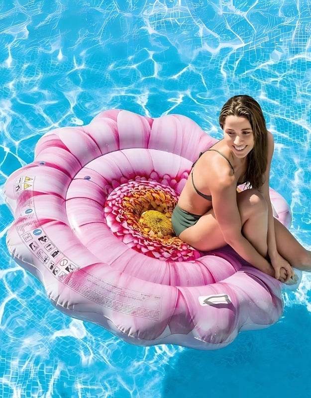 Woman relaxing on the Intex Pink Margarita Mat pool float in a swimming pool.