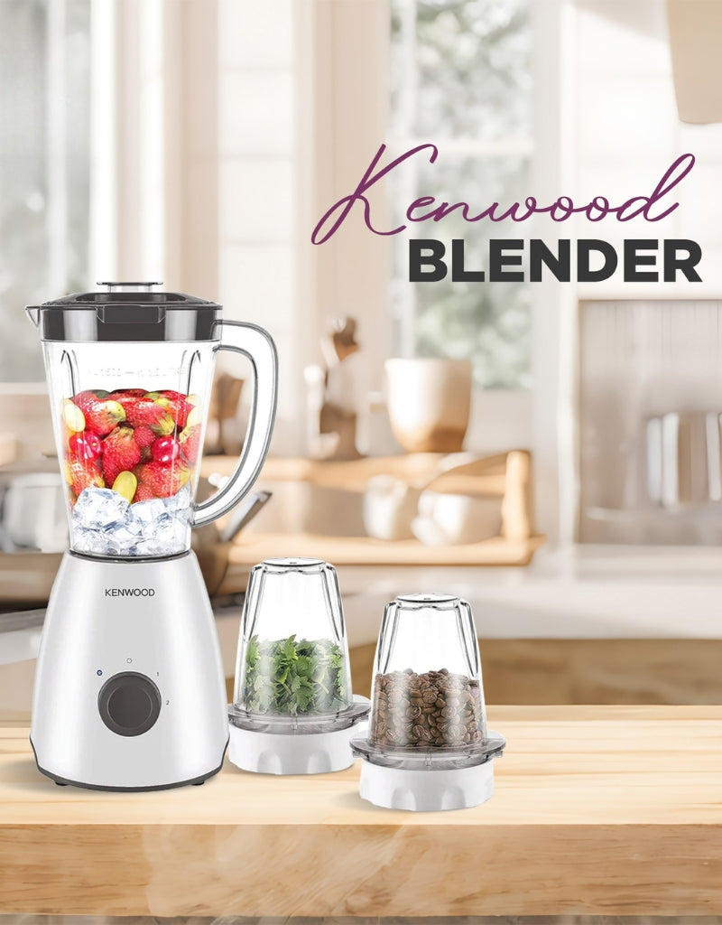 Kenwood 400W juicer blender with grinder and chopper displayed on a kitchen counter blending strawberries and ice