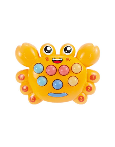 A young child smiling while playing the electronic Whack-a-Mole game toy, holding a yellow mallet