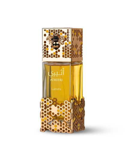 A bottle of Lattafé Atheeri Eau De Parfum Spray with a floral design on the cap and base, containing 100ml of the fragrance.
