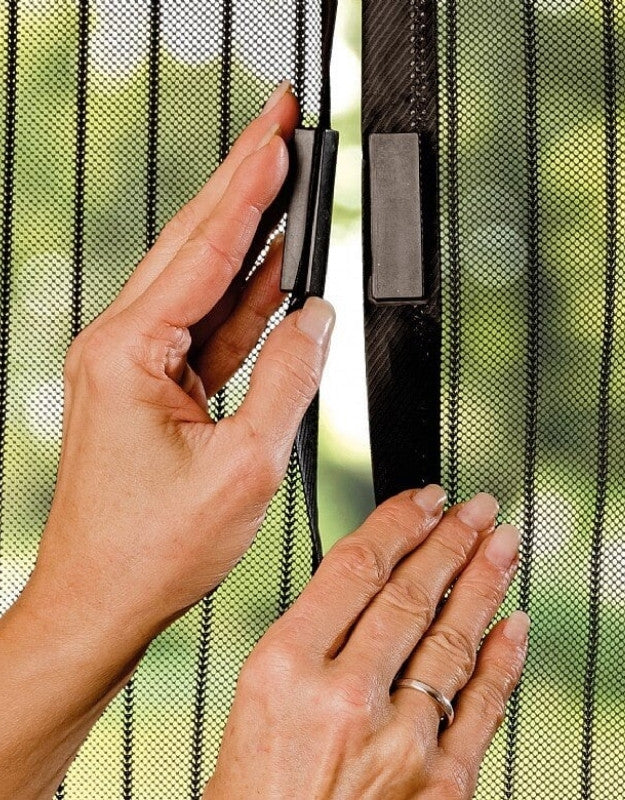 Close-up of strong magnetic closure system on mesh screen door keeping bugs out.