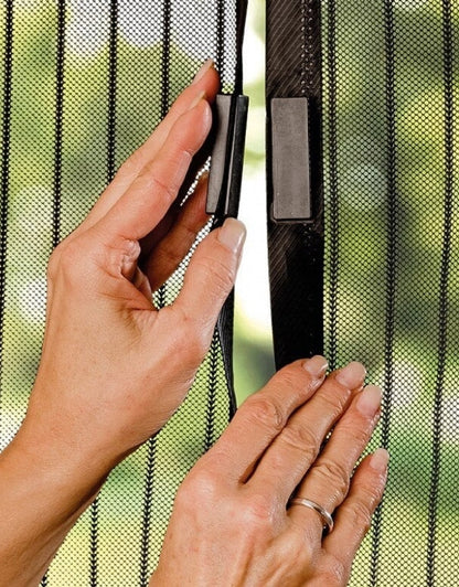 Close-up of strong magnetic closure system on mesh screen door keeping bugs out.