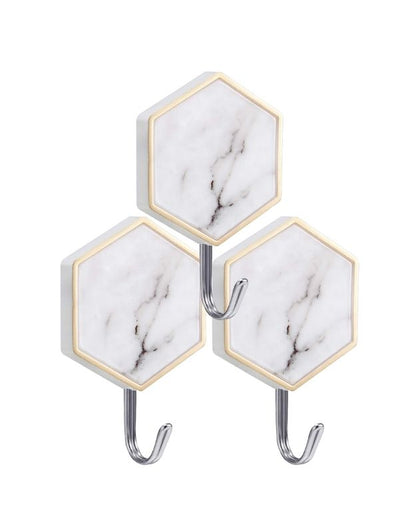 Hexagon marble adhesive wall hook with stainless steel hook.