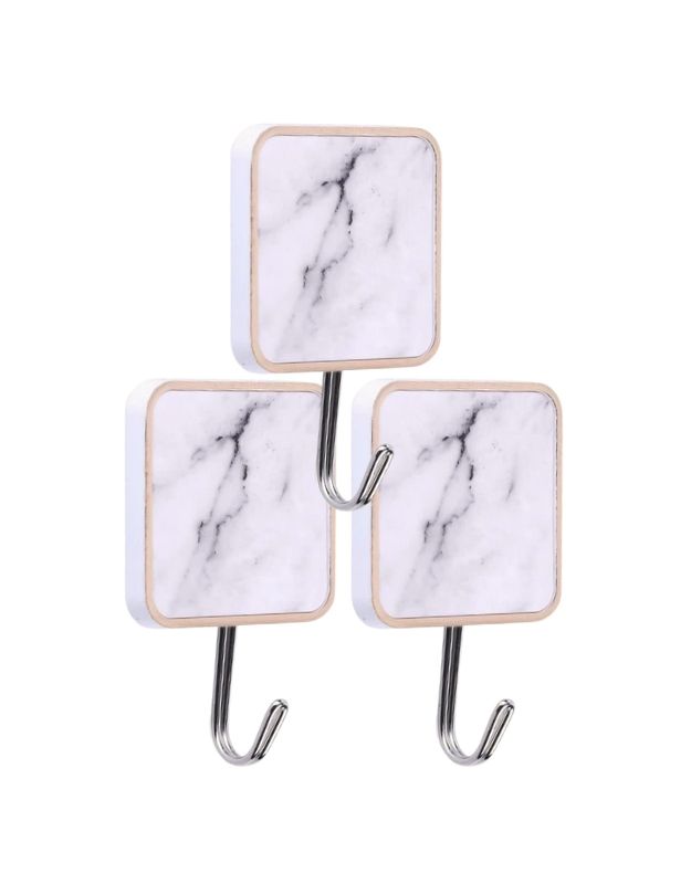 Square marble adhesive wall hooks for bathroom and kitchen organization.