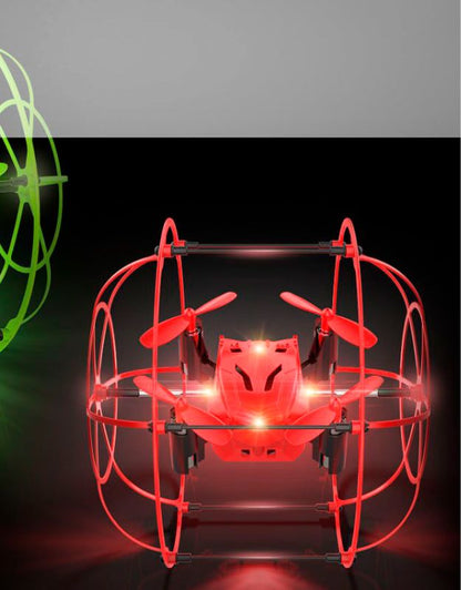 Red mini drone with protective cage and glowing LED lights in flight.