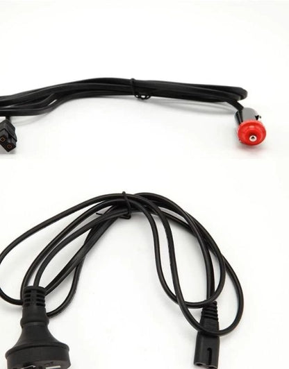 Two black cables with red and black connectors on a white background. Car power cable and 220V power cord for mini portable fridge.