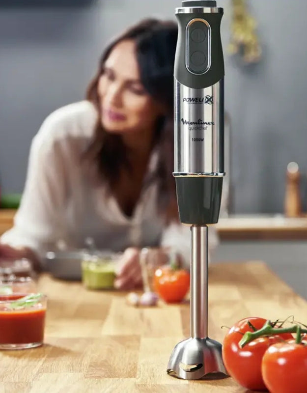 Moulinex QuickChef immersion blender 1000W standing on kitchen counter with tomatoes and sauces
