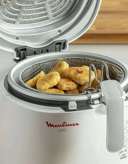 Close-up of Moulinex Uno fryer with crispy chicken nuggets inside the basket
