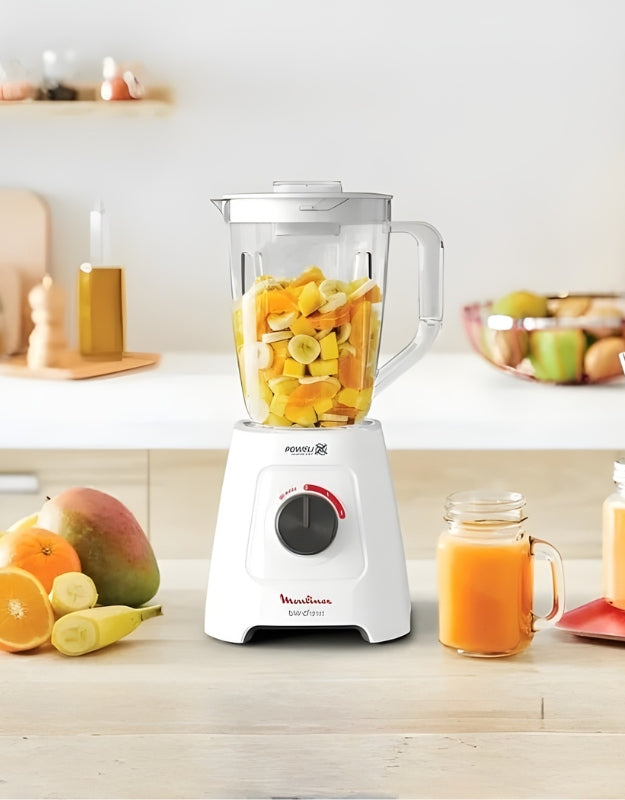 Moulinex Blend Force 2L Blender 600W with tropical fruits and fresh juice on kitchen counter
