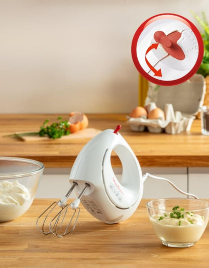 Moulinex Easy Max 200W kneader mixer resting on a kitchen counter with eggs and bowls, featuring rotating beater system.
