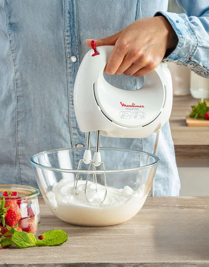 Moulinex Easy Max 200W hand mixer whipping cream in a glass bowl, ideal for baking and dessert preparation
