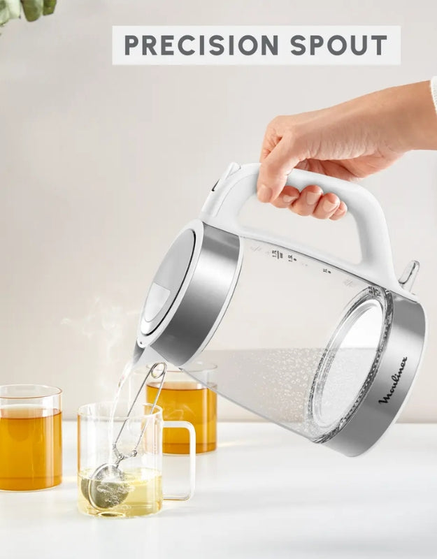 Moulinex glass electric kettle pouring hot water into a tea cup – ergonomic handle and precision spout