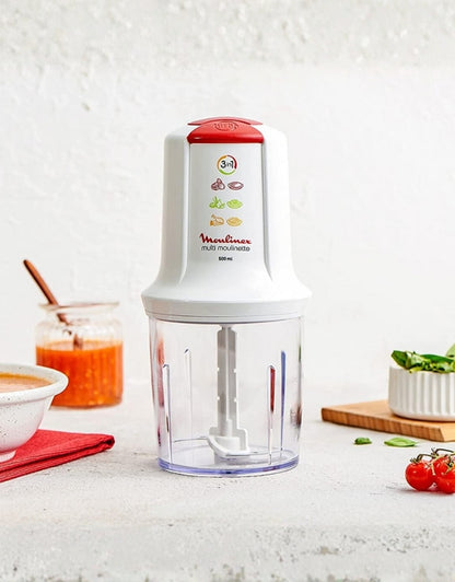 Moulinex Moulinette white chopper 500ml displayed on kitchen counter with sauces and fresh ingredients around