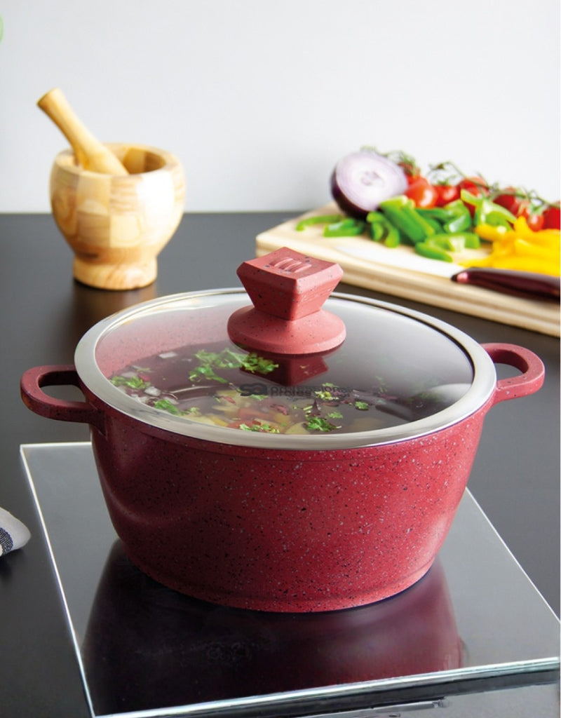 Nea Marbell red stockpot on stove filled with soup and vegetables – non-stick marble cookware