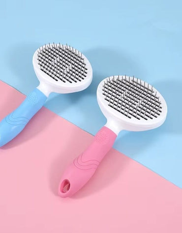 Blue and pink pet hair removal brushes with ergonomic handles.