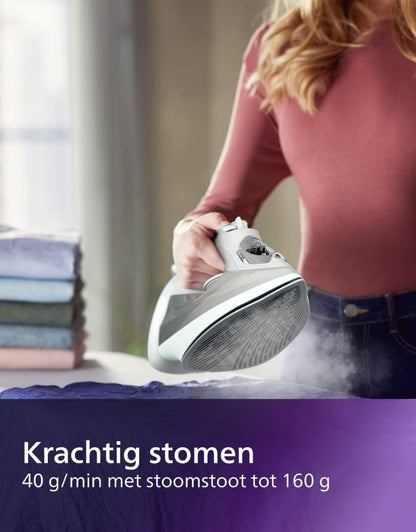 Philips 5000 Series 2400W steam iron in action emitting strong steam, ironing clothes efficiently