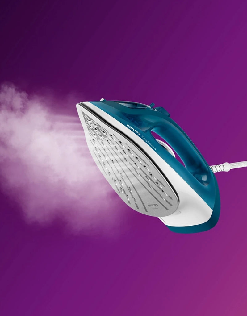 Philips EasySpeed Plus 2000W steam iron releasing powerful steam burst on purple background