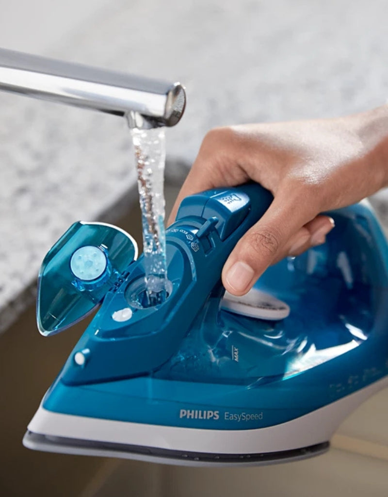 Philips EasySpeed Plus 2000W steam iron being refilled with water through wide filling hole