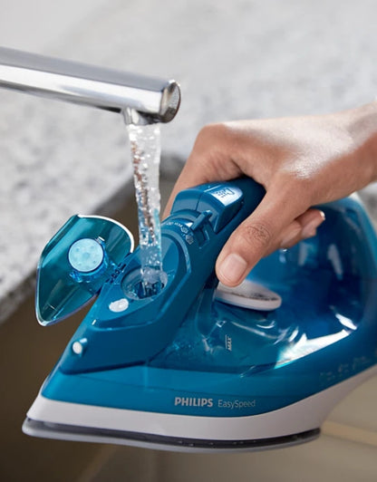 Philips EasySpeed Plus 2000W steam iron being refilled with water through wide filling hole