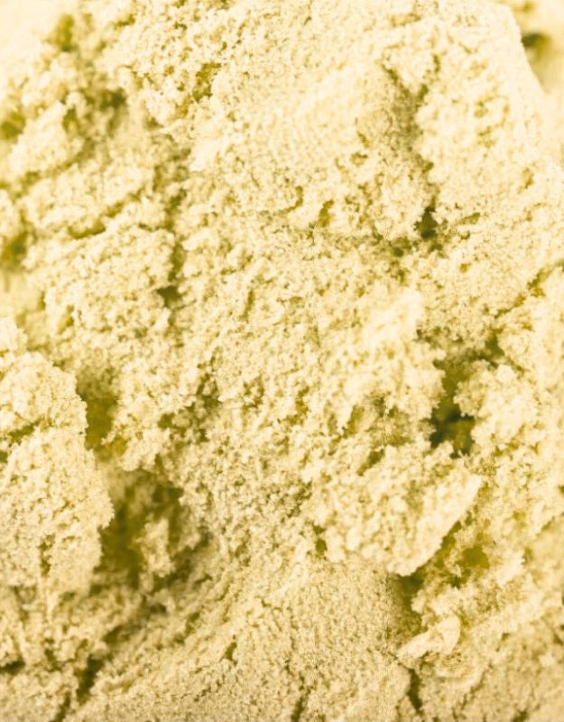 A detailed, close-up shot showing the unique texture of green or light yellow play sand