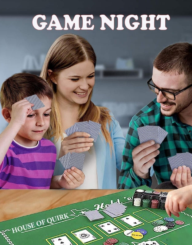 A family smiling while playing a game of poker, showing the chips set, cards, and green felt mat in use