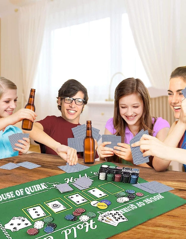 A group of friends smiling and playing poker with the professional poker chips set on a table
