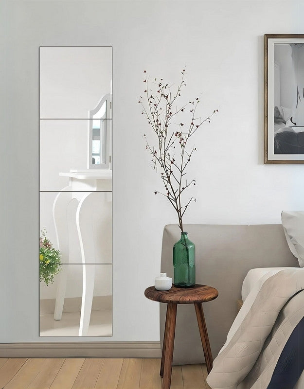 Rectangular wall mirror used as decorative bedroom wall decor.