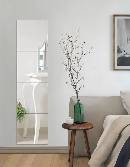 Rectangular wall mirror used as decorative bedroom wall decor.