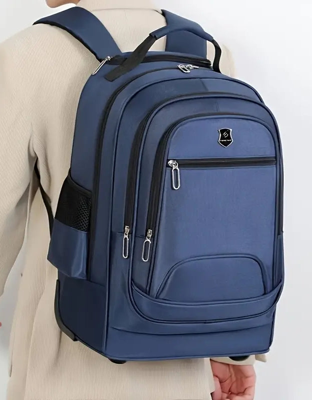 Student wearing blue rolling school backpack with wheels.