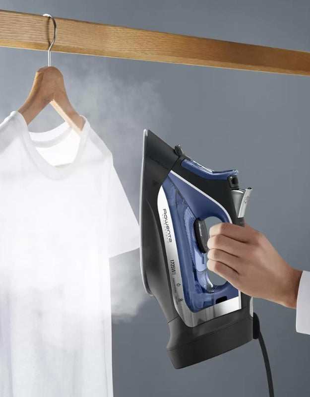 Rowenta Access steam iron used vertically to remove wrinkles from hanging clothes with strong steam burst