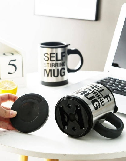 Self-stirring mug with removable base cover showing battery compartment.