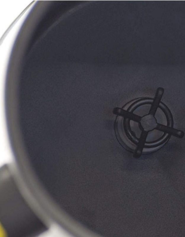 Inside view of self-stirring mug with built-in stirring mechanism.