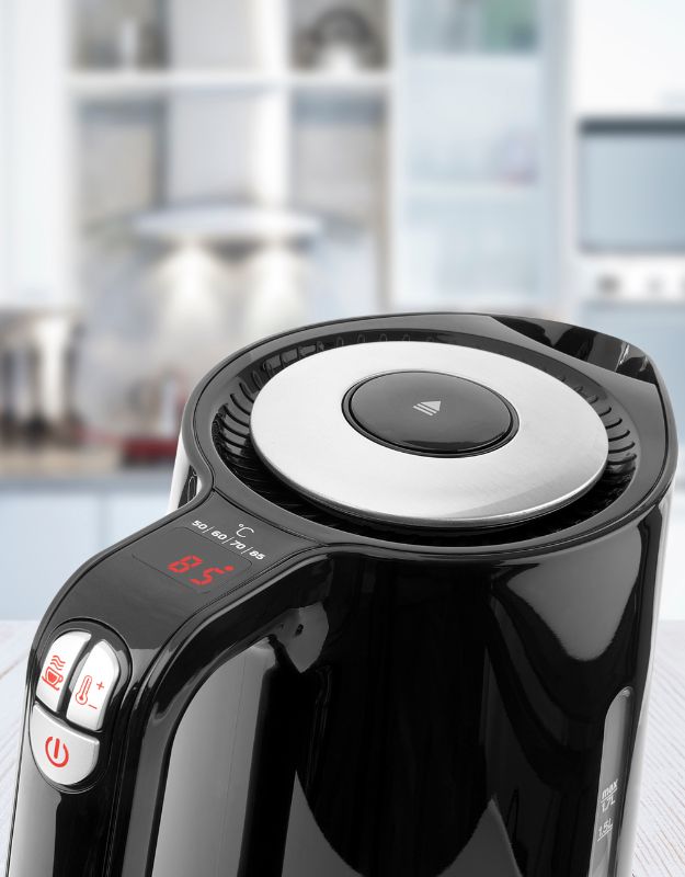 Close-up of Sencor electric kettle with digital display and controls.