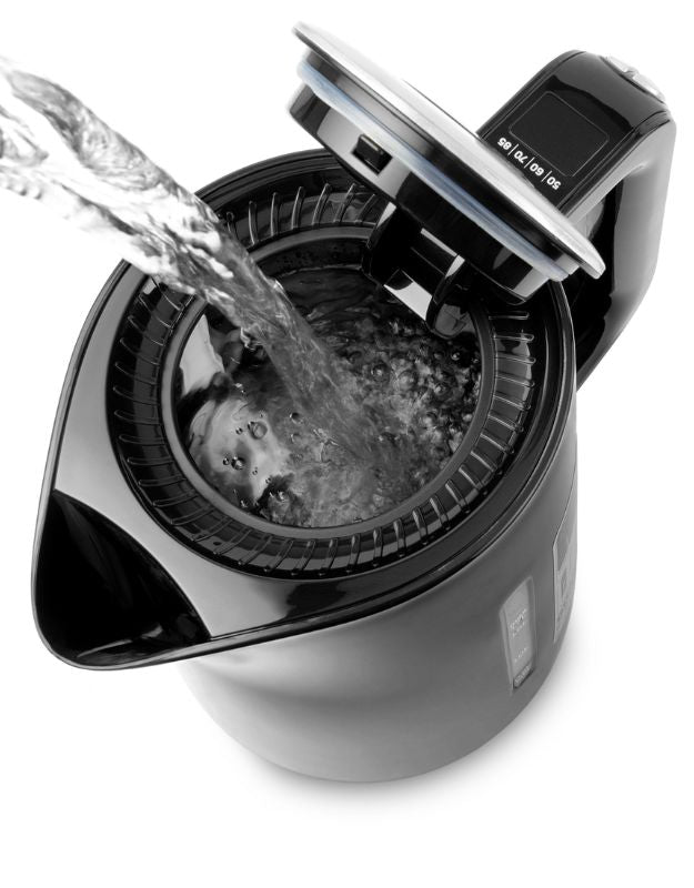 Water being poured into Sencor stainless steel electric kettle.