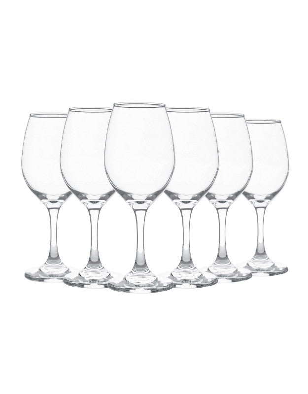 Set of six clear wine glasses on a white background. Set of six clear empty wine glasses with tall stems, arranged in a row on white background.