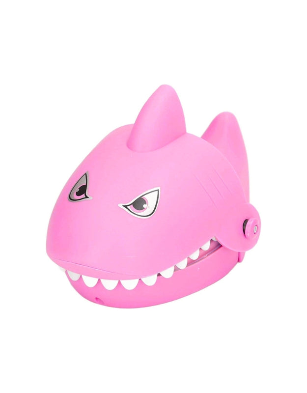 A simple, front-view product shot of the pink "Shark Dentist" toy with its mouth closed.