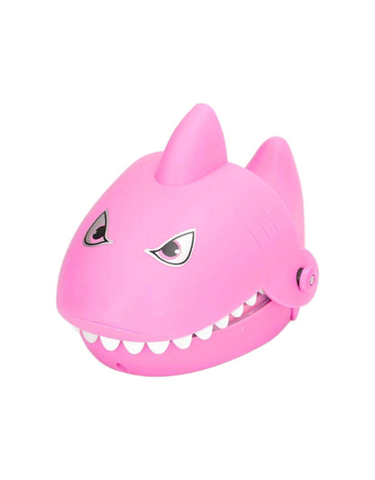 A simple, front-view product shot of the pink "Shark Dentist" toy with its mouth closed.