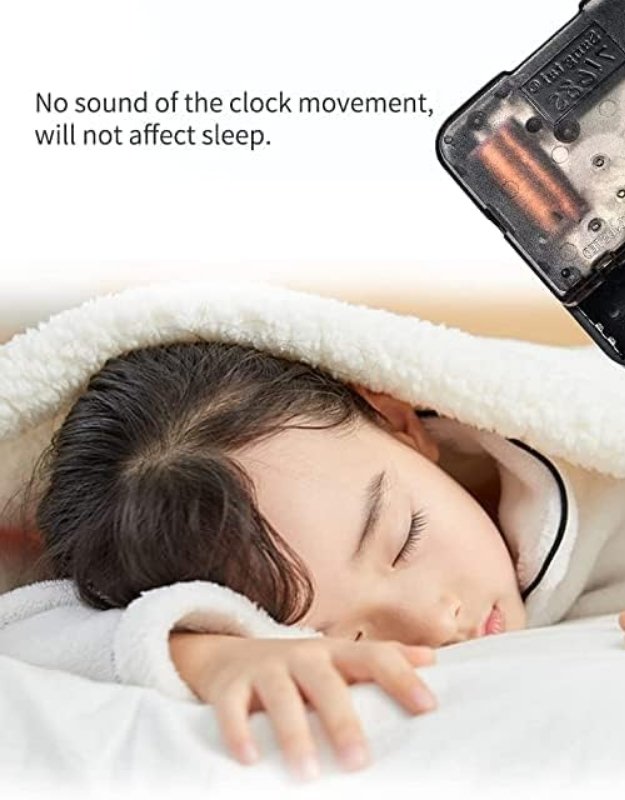 Child sleeping peacefully with a clock movement source off. Child sleeping peacefully with a silent wall clock mechanism that produces no ticking sound.