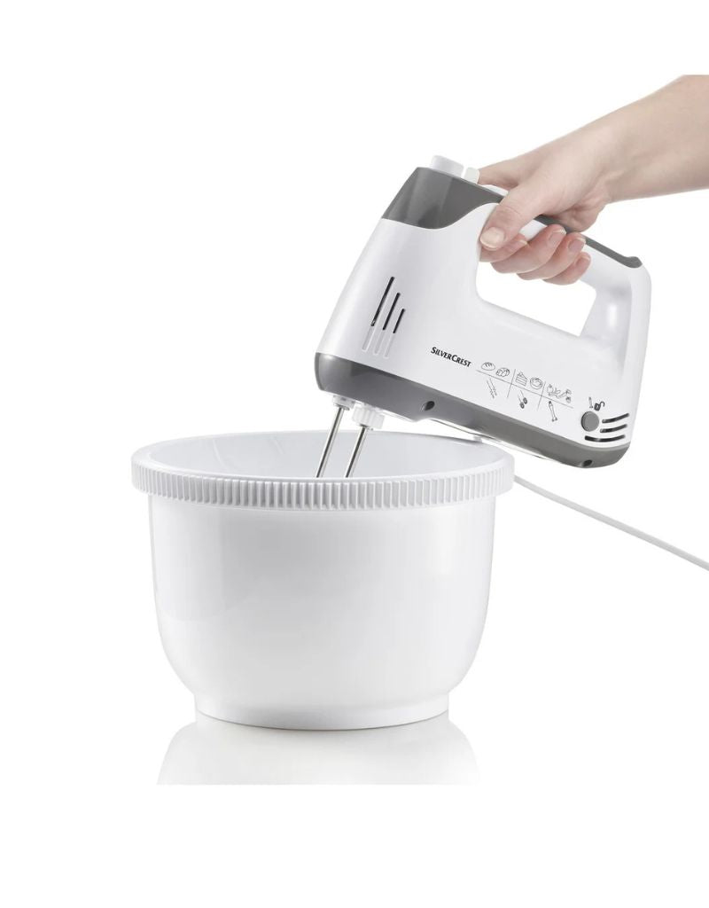 Person using Silver Crest 300W hand mixer with large mixing bowl for baking preparation