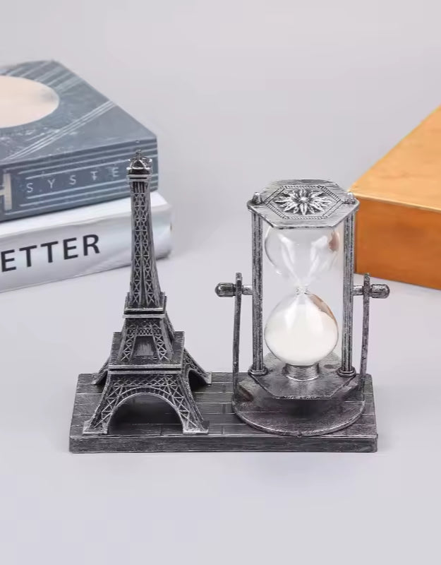 Silver Eiffel Tower with Hourglass Timer on Wooden Base – Tabletop with Books