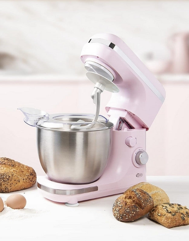 A pink Silvercrest multifunction stand mixer with a large stainless steel mixing bowl, shown with a dough hook attached and various baked goods around it.