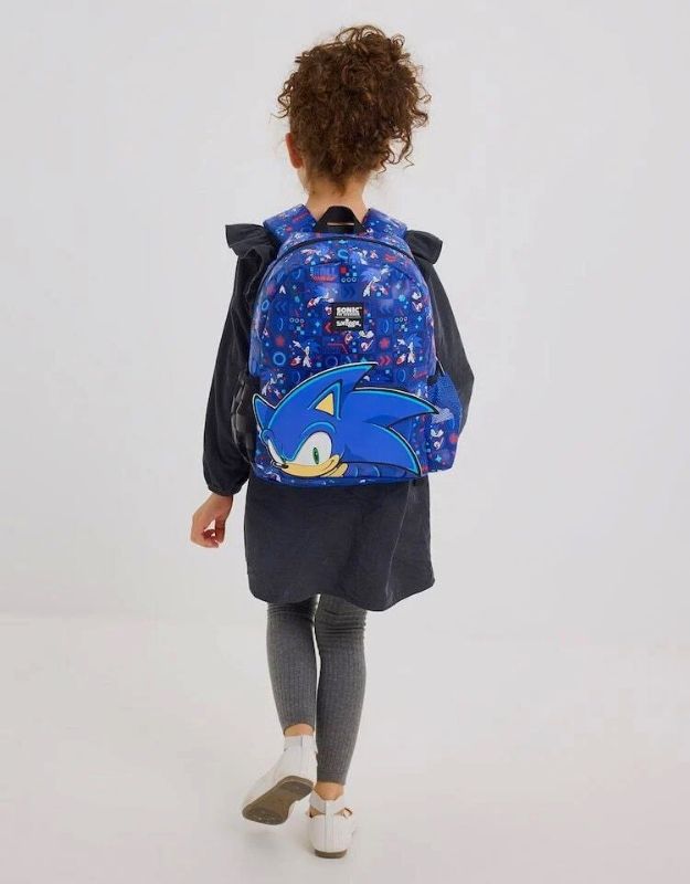Child wearing Smiggle 15" Sonic The Hedgehog junior hoodie backpack in blue, featuring Sonic character design