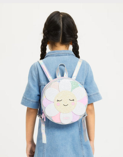 A child wearing a Smiggle flower backpack
