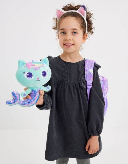 Girl holding the removable plush mermaid cat toy from the Smiggle Gabby’s Dollhouse Nursery Backpack.