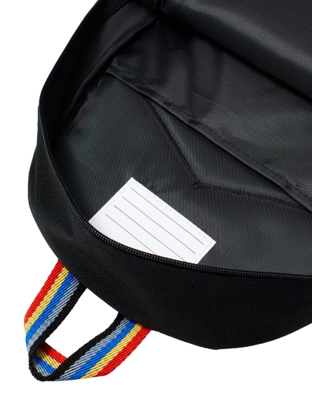  Inside of the Smiggle Lets Play backpack with a name tag.