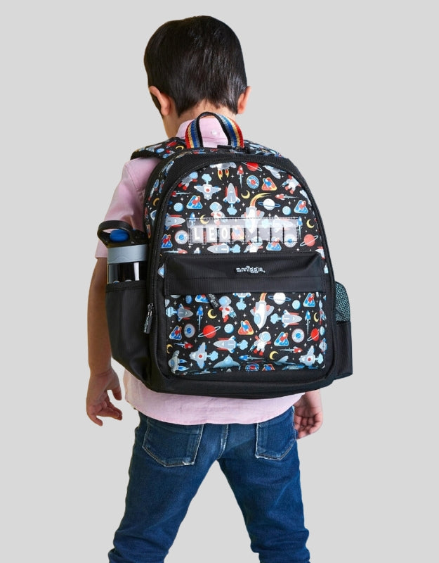  A child wearing the Smiggle Lets Play backpack