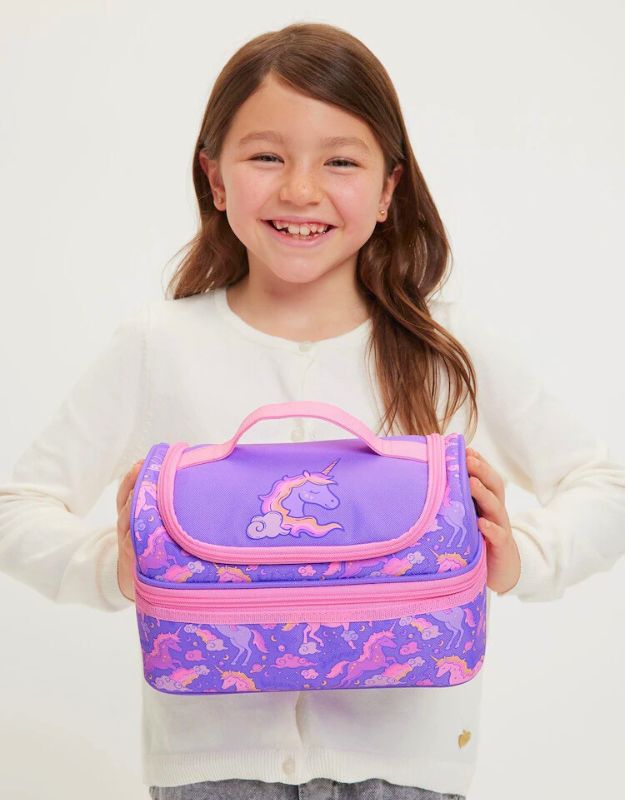 Child holding Smiggle Lilac Unicorn Double Decker Lunchbox with pink zipper